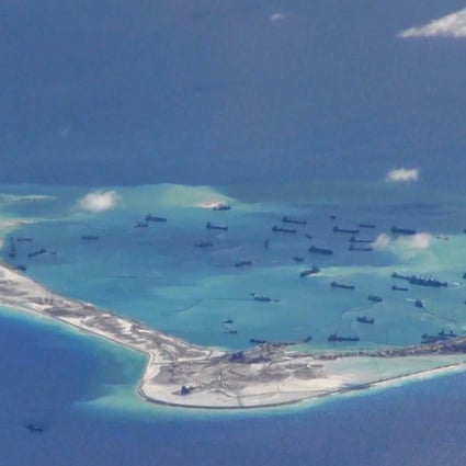 Chinese dredging vessels are purportedly seen in the waters around Mischief Reef in the disputed Spratly Islands in the South China Sea, in this 2015 handout photo from the US Navy. Photo: Reuters