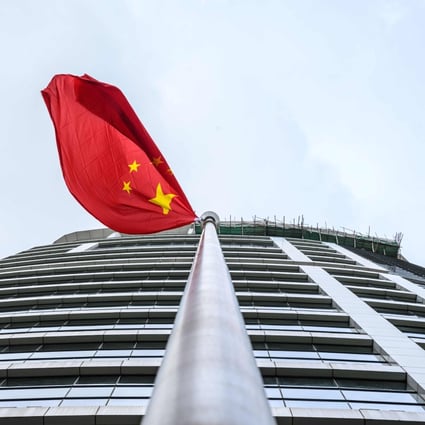 The Chinese flag flies outside the Office for Safeguarding National Security in Hong Kong. Photo: AFP