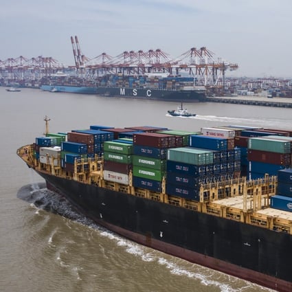 A vessel loaded with containers approaches the Yangshan Deepwater Port, off Shanghai, on July 12. China’s exports have exceeded market expectations for five consecutive months. Photo: Bloomberg