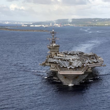 The aircraft carrier USS Theodore Roosevelt departs Guam’s Apra Harbour in June. Photo: US Navy via AP