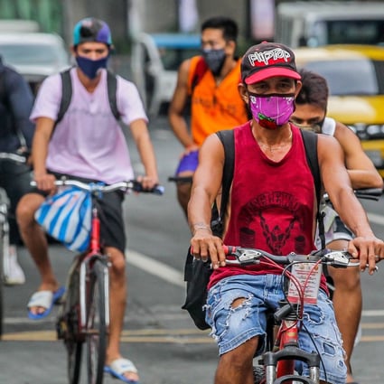 People seen wearing face masks in Manila, Philippines. Photo: Xinhua