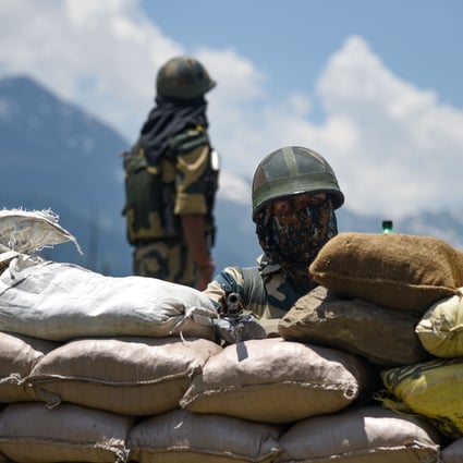 Indian soldiers guard a national highway near the Ladakh region. Photo: DPA