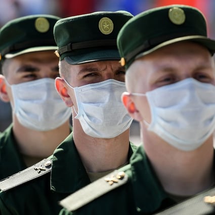 Russian servicemen wearing face masks in Moscow. The total number of coronavirus cases in Russia passed the 1 million mark on Tuesday. Photo: AFP