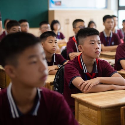 Students were back in the classroom at the Daowu Middle School in Liuyang, Changsha, on Monday. Schools in the Hunan capital were among the first to reopen. Photo: Xinhua
