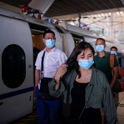 People arrive at Wuhan railway station on Wednesday. The new virus was first reported in the central Chinese city late last year. Photo: Reuters