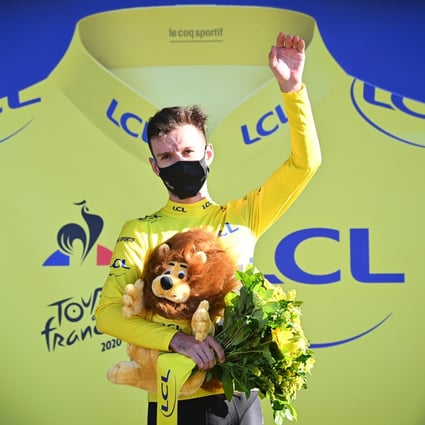 British cyclist Adam Yates of team Mitchelton-Scott celebrates on the podium in the yellow of overall leader after the 5th stage of the 107th edition of the Tour de France. Photo: DPA