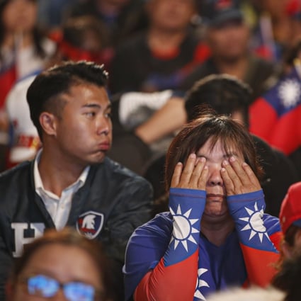 Dejected supporters of Kuomintang presidential candidate Han Kuo-yu follow the online counting of ballots in Kaohsiung on January 11. The party was defeated in the last two presidential elections, before the Kaohsiung mayoral setback in August. Photo: EPA-EFE