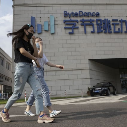 Two women walk near the Beijing headquarters of ByteDance on August 7. China’s revised tech export controls have complicated negotiations for TikTok owner ByteDance to divest the US operation of its popular short video-sharing service. Photo: AP