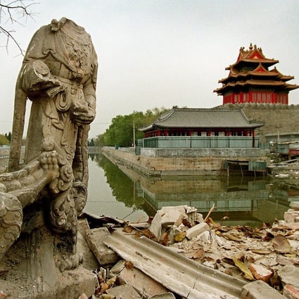 Old structures, including statues like this one in 1998, were torn down near Beijing’s Forbidden City as money and power joined hands in property development. Photo: Mark Ralston