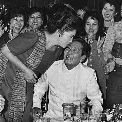 Ferdinand Marcos receives a kiss from his wife Imelda following his victory in the 1986 presidential election. Photo: AFP