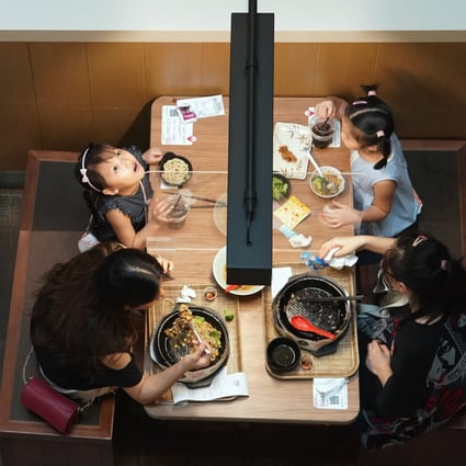 Customers eat lunch at a restaurant in Causeway Bay on Friday. Photo: Felix Wong