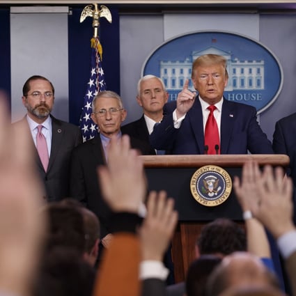 President Donald Trump answers questions after speaking about the coronavirus at the White House in Washington as Health and Human Services Secretary Alex Azar, National Institute for Allergy and Infectious Diseases Director Dr Anthony Fauci, Vice President Mike Pence, Robert Redfield, director of the Centres for Disease Control and Prevention and US Surgeon General Dr Jerome Adams listen. Photo: Carolyn Kaster / AP Photo