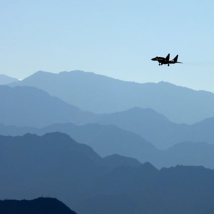 An Indian Air Force fighter jet flies over a mountain range in Leh, the joint capital of the union territory of Ladakh, which borders China. Photo: AFP