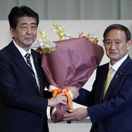 Shinzo Abe (left), Japan’s former prime minister, with his successor Prime Minister Yoshihide Suga. Photo: AP