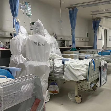 Medical workers treat Covid-19 patient Zhang Lifa, father of Zhang Hai, on January 30 at a hospital in Wuhan. Zhang Hai has emerged as a vocal advocate and spokesman for families of virus victims. Photo: AFP/Zhang Hai