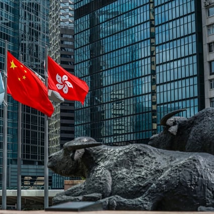 The flags of China and Hong Kong fly outside Exchange Square, which houses the Hong Kong stock exchange, on May 29. Photo: Bloomberg