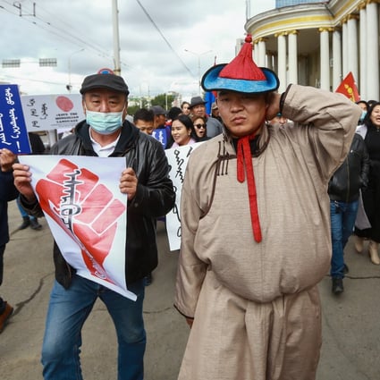 Protesters, many in traditional dress, gather in Ulan Bator, in response to the Chinese foreign minister Wang Yi’s visit to Mongolia on Tuesday. Photo: EPA-EFE