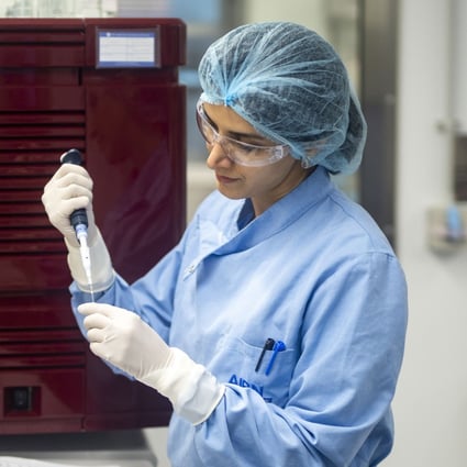 A researcher works at a University of Queensland (UQ) laboratory, as part of an effort to develop a potential Covid-19 vaccine. Photo: Xinhua