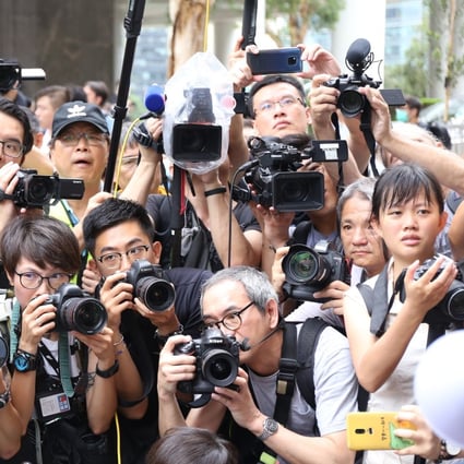 Reporters last year taking pictures of protesters outside the British consulate in Hong Kong. Photo: Rachel Cheung