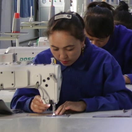 Uygur women see working in a clothing factory in Hotan county in Xinjiang autonomous region.