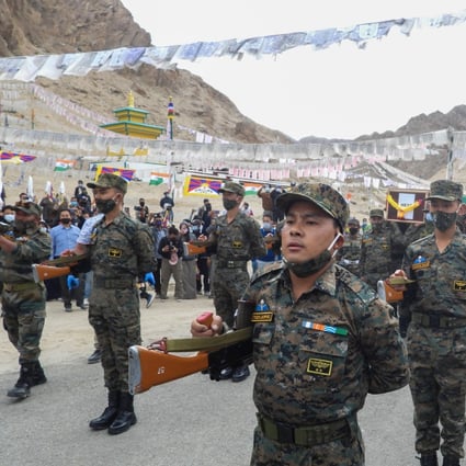 Indian soldiers pay their respects during the funeral of Nyima Tenzin in Leh. Photo: AFP