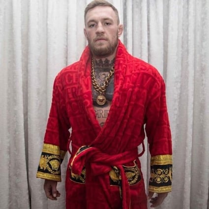 Conor McGregor in a red Versace robe, also worn by Drake, Kanye and Kevin Hart. Photo: Instagram/@thenotoriousmma