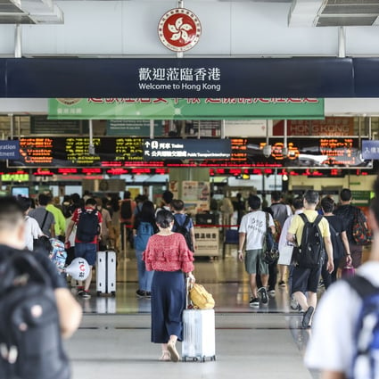 People cross from the Futian Border in Shenzhen, into Hong Kong’s Lok Ma Chau Border Station, before the coronavirus stopped travel. Photo: Roy Issa