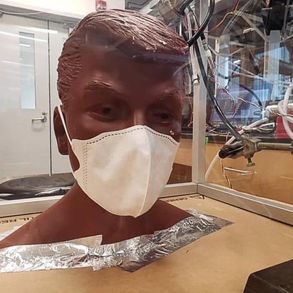 Origami and commercial masks were tested on a mannequin in a chamber filled with tracing particles. Photo: James Smith/University of California, Irvine