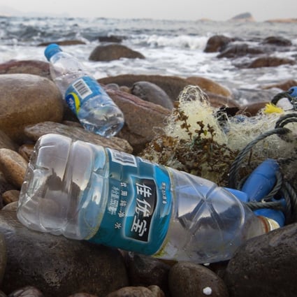 Discarded plastic bottles washed up on a beach in Hong Kong. Consumers have complained about being put off recycling by labels that are hard to peel off and the need to wash bottles first. Photo: EPA-EFE