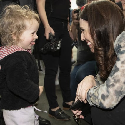 New Zealand Prime Minister Jacinda Ardern is greeted by a young child while campaigning in Christchurch. Photo: AP