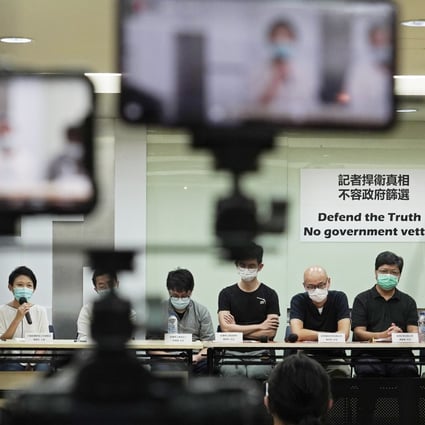 Media organisation representatives attend a press conference in Hong Kong on September 24 to protest against new rules restricting who can provide press coverage during demonstrations, saying the government has no right to determine who is or isn't a reporter. Photo: AP