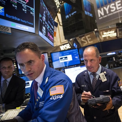 Traders work on the floor of the New York Stock Exchange during the afternoon of September 5, 2014 in New York City. Photo: AFP
