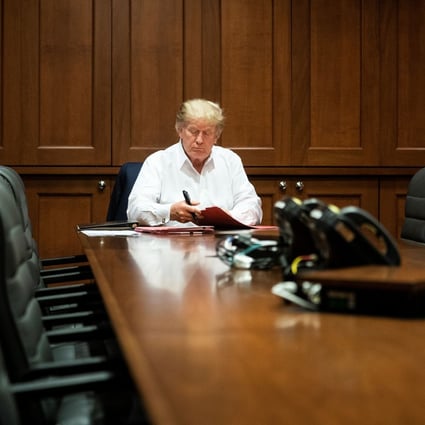 US President Donald Trump works in a conference room at Walter Reed National Military Medical Center while receiving treatment for Covid-19. Photo: Reuters