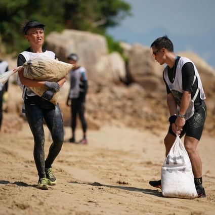 Ellen Hai-yee Lun’s (left) determination to carry heavy sandbags brought a tear to the organiser’s eye. Photos: Spartan Race