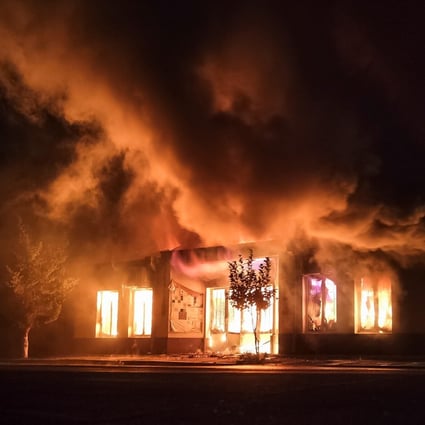 A shop is seen on fire following recent shelling during a military conflict over the breakaway region of Nagorno-Karabakh on Saturday. Photo: Reuters