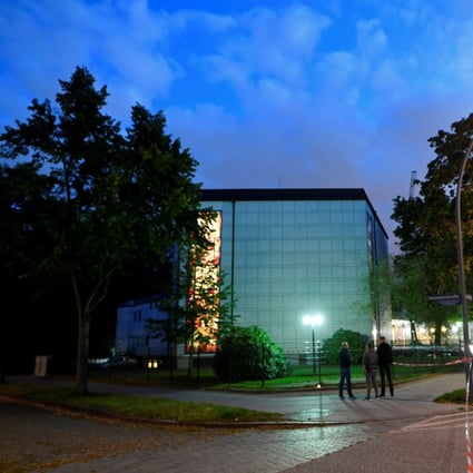 Police secure the area where a Jewish man was attacked in front of a Hamburg synagogue. Photo: Reuters