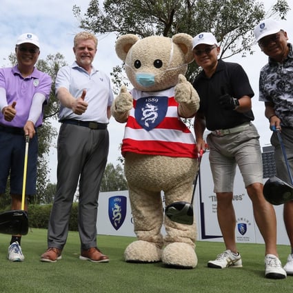 Hong Kong Golf Club general manager Ian Gardner (third left) poses with golfers and club mascot Fanling Freddie at the club’s Open Day. Photo: May Tse