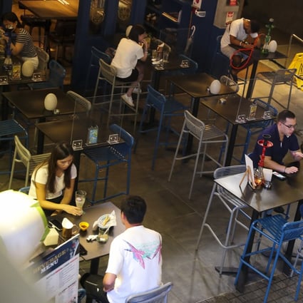 Customers drink at a bar in Tsim Sha Tsui on Monday evening. Photo: Edmond So