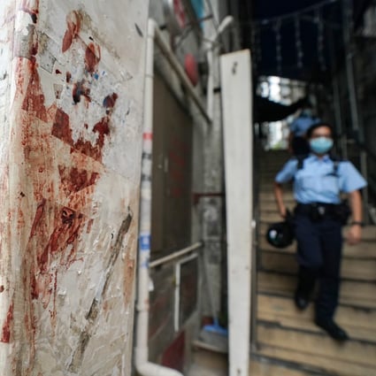 Blood stains can be seen at the site of a brawl that erupted in Tsim Sha Tsui. Photo: Felix Wong