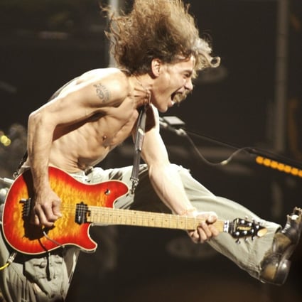 Eddie Van Halen plays the final chord of ‘Jump’ during a Van Halen concert in New Jersey in June 2004. Photo: NJ Advance Media via AP