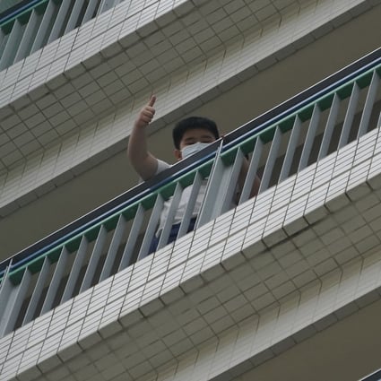 A student waves to the media at Alliance Primary School in Kowloon Tong. Photo: Felix Wong