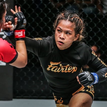 Denice Zamboanga throws a punch at Jihin Radzuan. Photos: ONE Championship