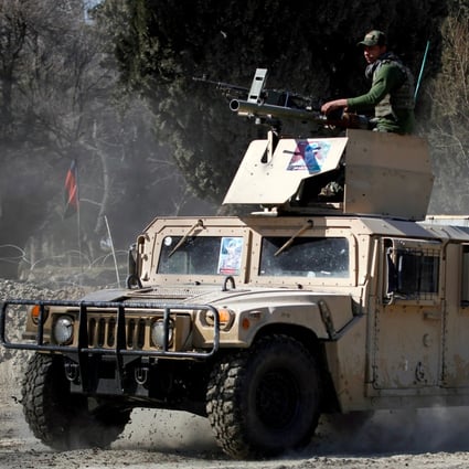 An armoured vehicle patrols near the site of an incident where two US soldiers were killed in February in Nangarhar province, Afghanistan. Photo: Reuters
