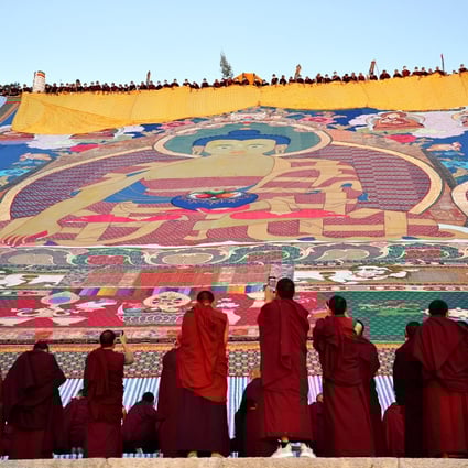 The “sunning of the Buddha” ceremony is held at the Drepung Monastery in Lhasa in August. A senior official said there would be an “orderly” opening up in Tibet. Photo: Xinhua