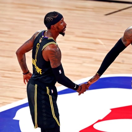 Los Angeles Lakers guard Kentavious Caldwell-Pope celebrates with forward LeBron James after making a three pointe against the Miami Heat in game five of the 2020 NBA Finals. Photo: USA Today Sports