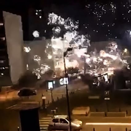 A screengrab of a Twitter video shows fireworks exploding outside the police station of Champigny-sur-Marne on Saturday night. Photo: Twitter @LeCapricieux94 / AFP