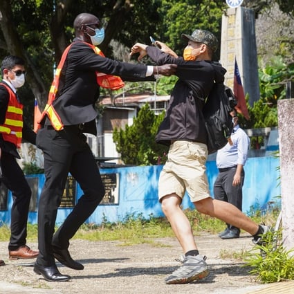 A scuffle erupts between a Taiwanese supporter and a security guard at Sun Yat-sen Garden in Tuen Mun on Saturday. Photo: Winson Wong