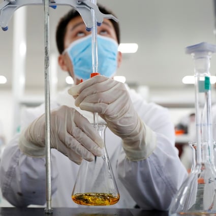 A man works in a laboratory of Chinese vaccine maker Sinovac Biotech in Beijing, China. Photo: Reuters