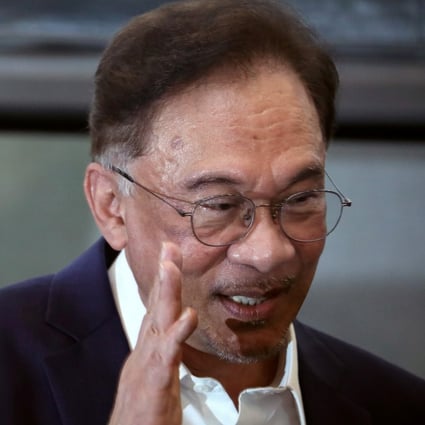 Malaysian opposition leader Anwar Ibrahim waves after the news conference last month in which he announced he had enough support to topple the government of Muhyiddin Yassin. Photo: Reuters
