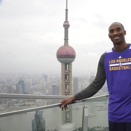 Kobe Bryant of the Los Angeles Lakers poses for a photo as part of the NBA Global Games in Shanghai in October, 2013. Photo: AFP